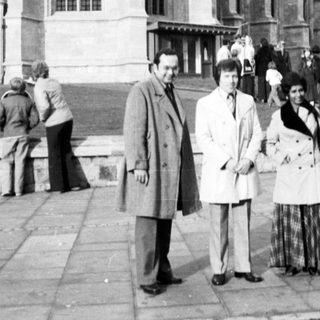 Historic castle exterior with group posing outside.