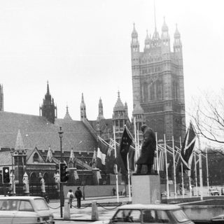 Historic London street scene with Parliament buildings.