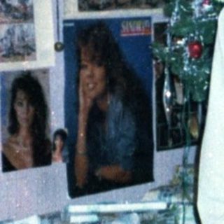 Young boy holding gift in festive room.