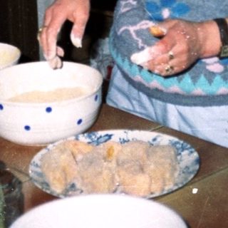 Woman baking in a vintage kitchen.