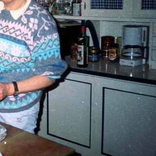 Woman baking in a vintage kitchen.