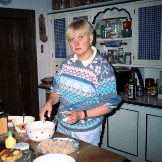 Woman baking in a vintage kitchen.