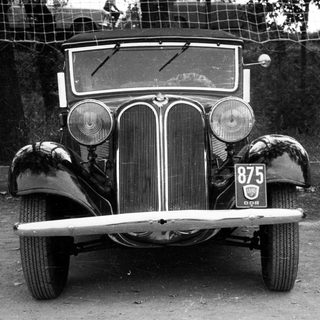 Vintage car with BMW logo, license plate 875.