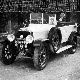 Vintage race car, numbered 12, early 20th century.