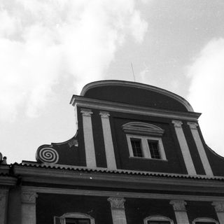 Neoclassical building facade with decorative columns.
