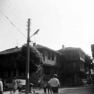Vintage street scene with traditional wooden houses.