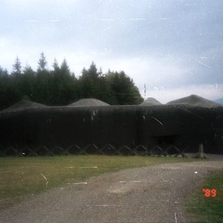 Concrete bunker structure in outdoor setting.