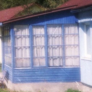 Colorful cabins in a forested area.