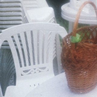 Woman enjoying outdoor meal with mushrooms.