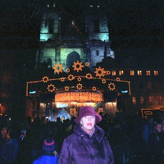 Christmas market scene with illuminated star decorations.
