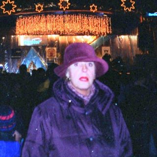 Christmas market scene with illuminated star decorations.