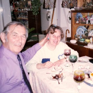 Happy couple enjoying a festive meal together.
