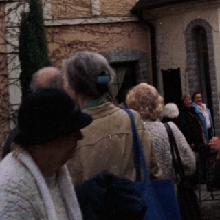 People gathered outside a hotel during an event.