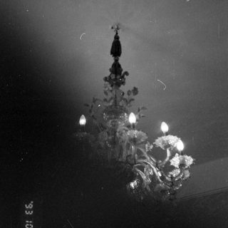 Ornate chandelier with illuminated candles.