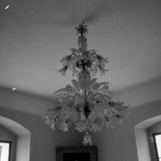 Elegant chandelier hanging in a vintage room.