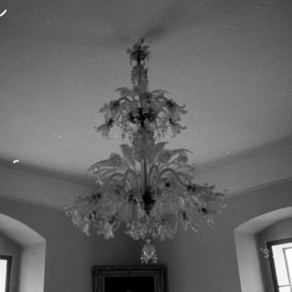 Elegant chandelier hanging in a vintage room.