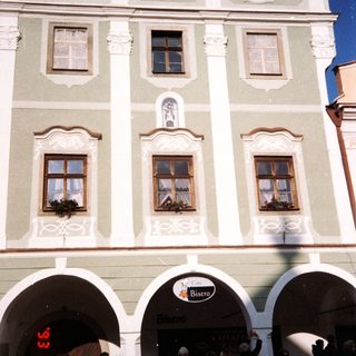 Elegant historic building housing "Bistro" with arched entrance.