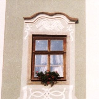 Elegant historic building housing "Bistro" with arched entrance.