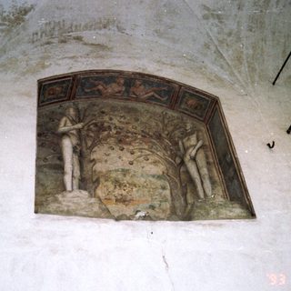 Relief sculpture in arched niche depicting figures.