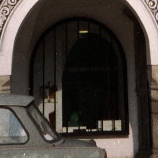 Baroque-style ornate building facade with intricate carvings.