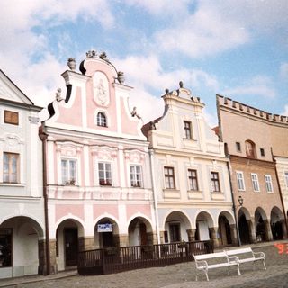 Historic European town square with Baroque-style buildings.