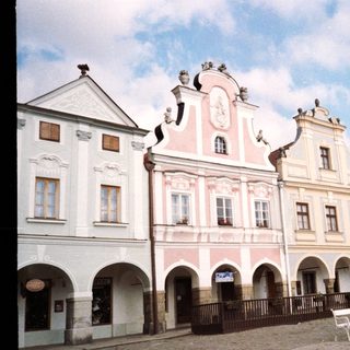 Historic European town square with Baroque-style buildings.