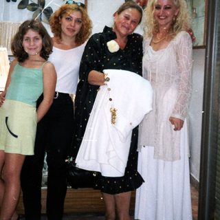 Four women posing in a clothing store.