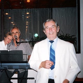 Three people performing live music indoors.