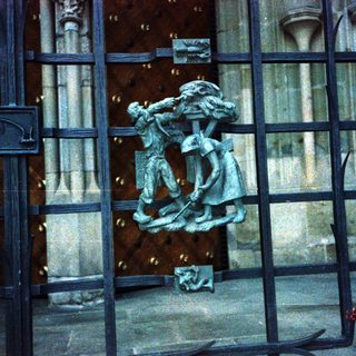 Relief sculpture of medieval knight and woman.