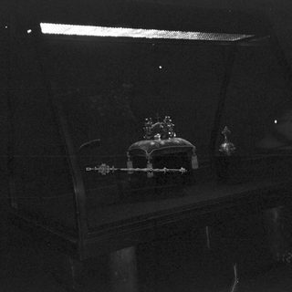 A dimly lit nighttime view of a cake.