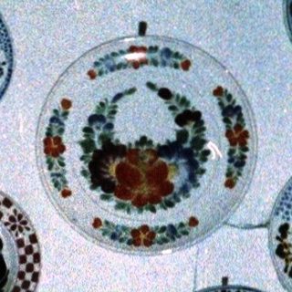 Vintage ceramic and porcelain wall display collection.