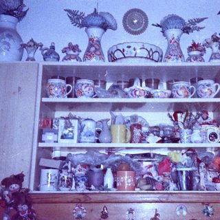 Vintage ceramic collection on shelves.