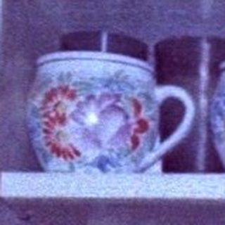 Vintage ceramic collection on shelves.