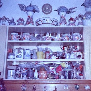 Vintage ceramic collection on shelves.