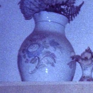 Vintage ceramic collection on shelves.