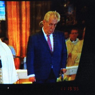 Religious ceremony with bishop and dignitary.