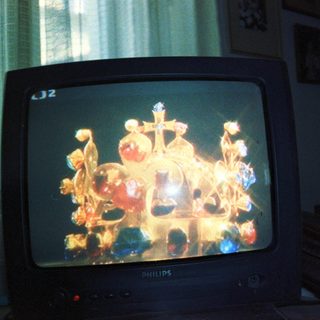Ornate Orthodox church iconostasis on old TV screen.