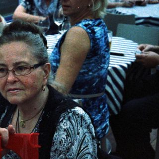 Group of people at a seated event or party.