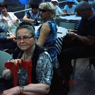 Group of people at a seated event or party.