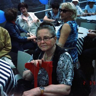 Group of people at a seated event or party.