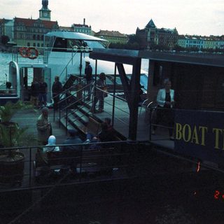 Boat dock with "Boat Trips" sign by waterfront.