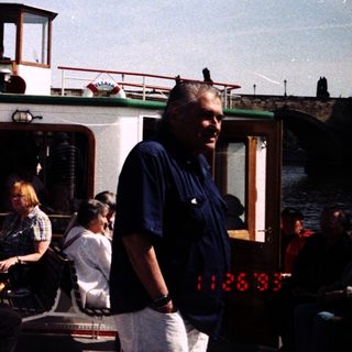 Boat with passengers and crew on river.