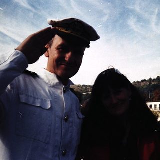 Three people posing outdoors in vintage naval caps, dated 1993.