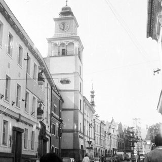 Historic European street with clock tower.