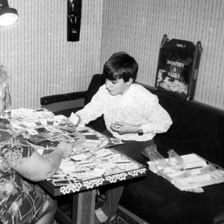 Two women and a child playing board game.