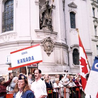 Polish-Canadian gathering with flags and signs.