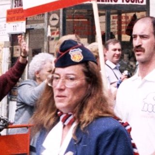 Polish-Canadian gathering with flags and signs.
