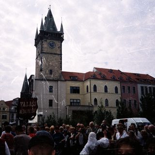 Crowd gathers in front of Prague Old Town Tower.