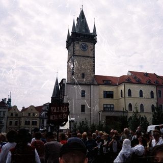 Crowd gathers in front of Prague Old Town Tower.