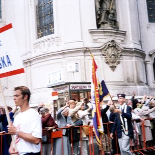 Protest rally with American and Sokols flags.